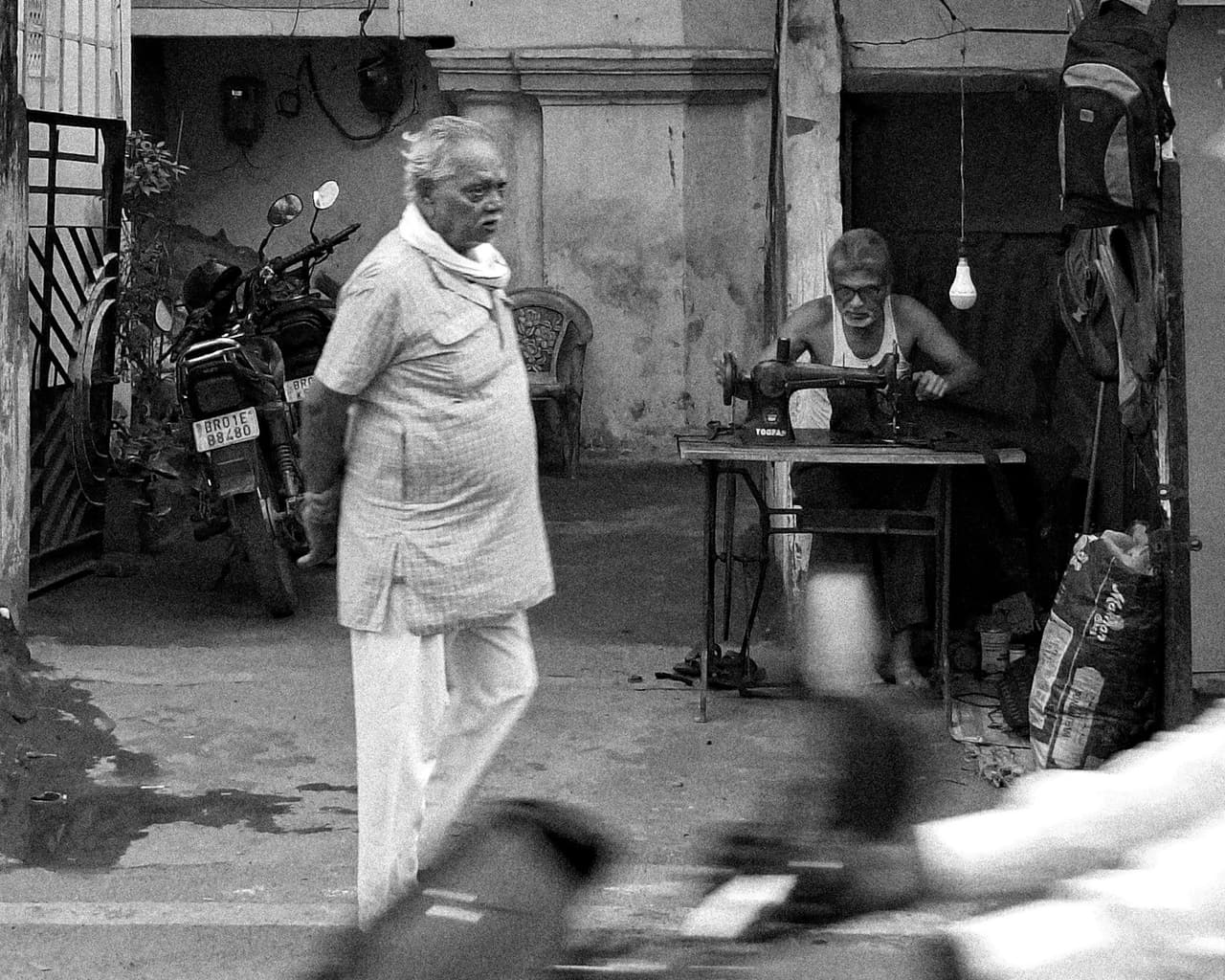 A tailor at a sewing machine
