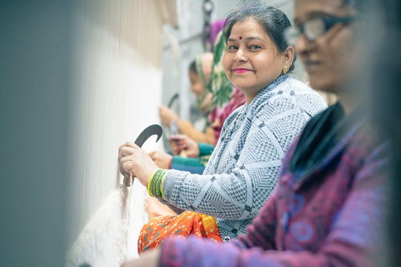 A handloom carpet weaver at work in Agra